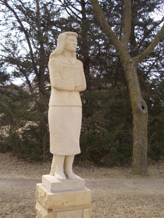 Contemplation - life-size limestone student, Fort Hays State, Hays, KS
