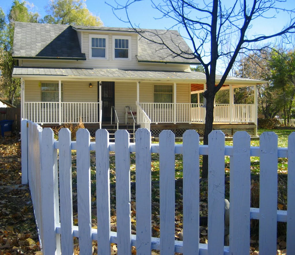 white picket fence and wrapping porch