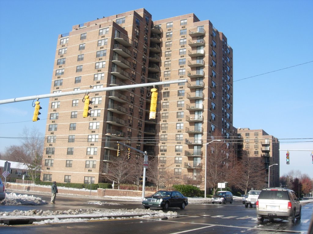 apartments and melted snowy street