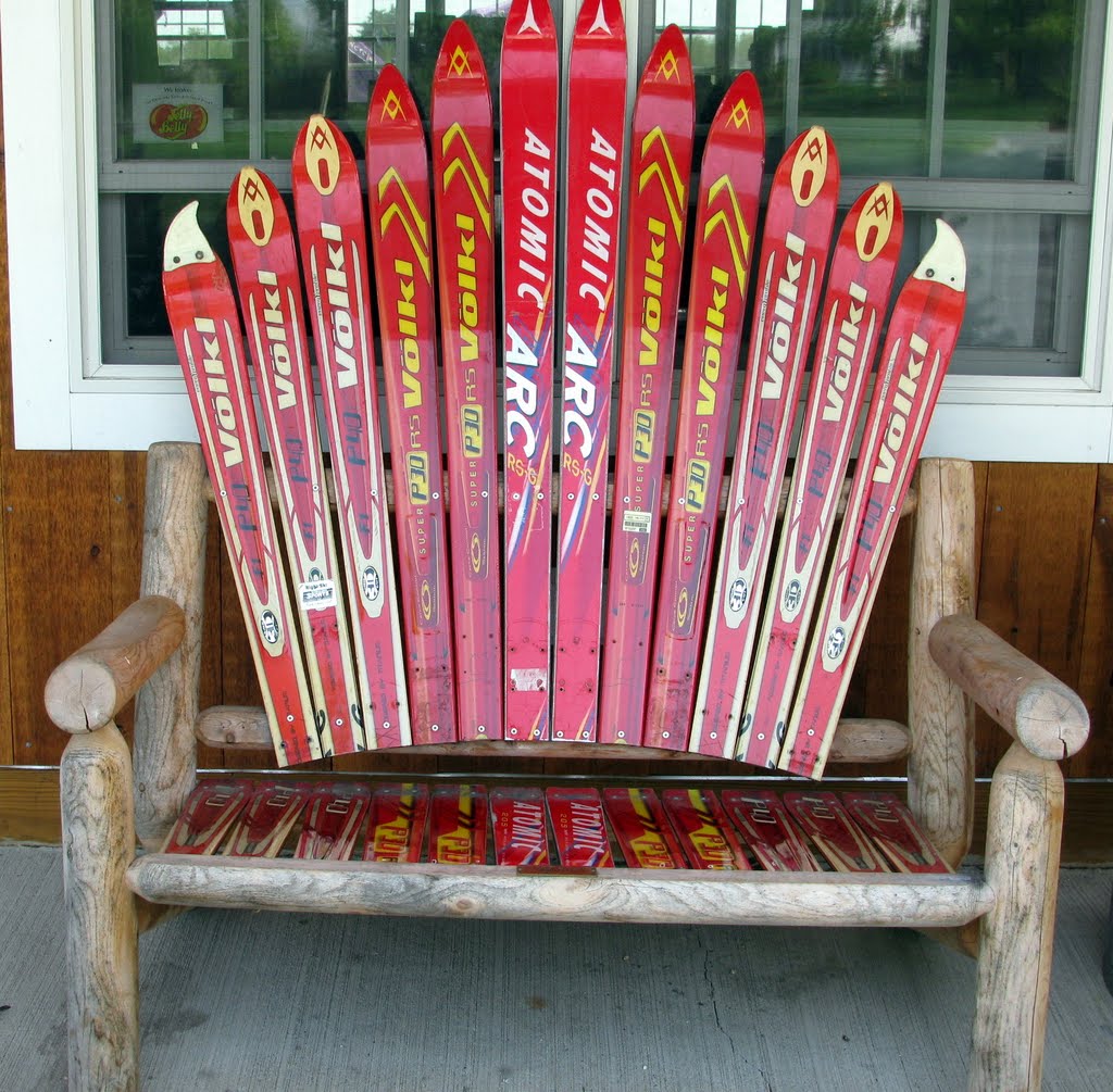 ski collection on a bench..