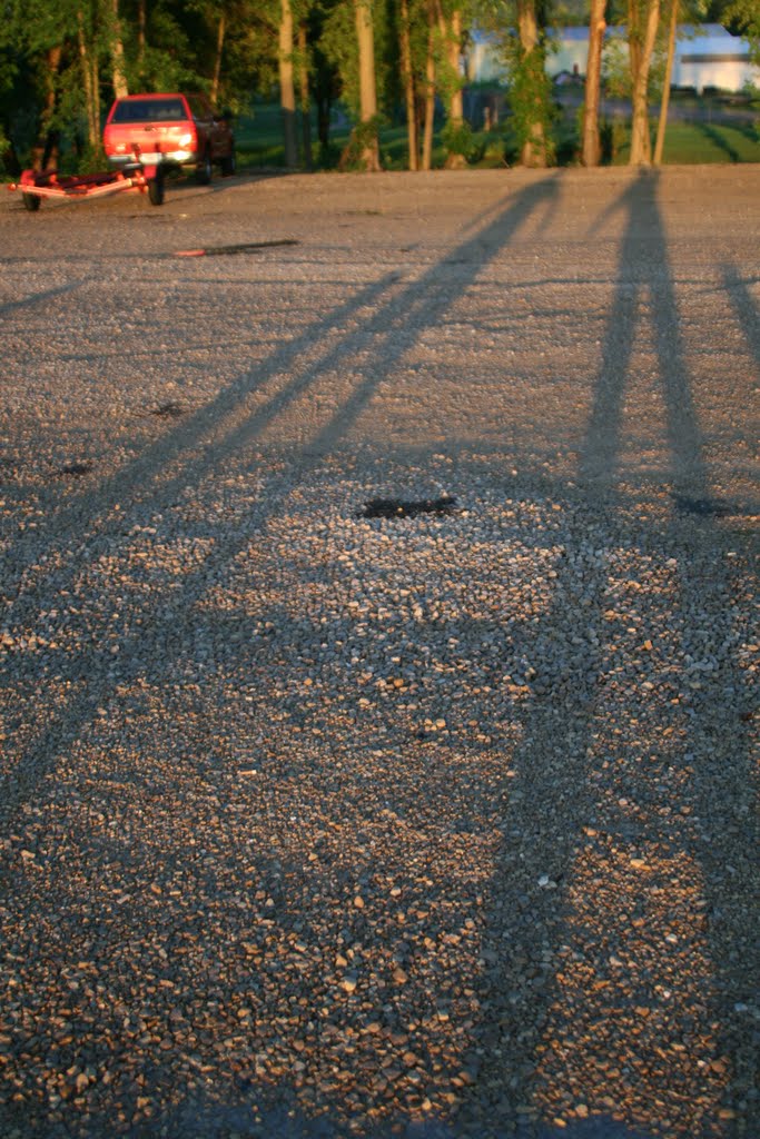 Sunset casts long shadows of my son and I at Stoddard boat landing