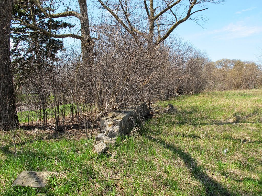 Remains of a retaining wall that once stood in Lilac Park, now inside the exit ramp from northbound Highway 100 to Minnetonka Blvd. Looking northwest.