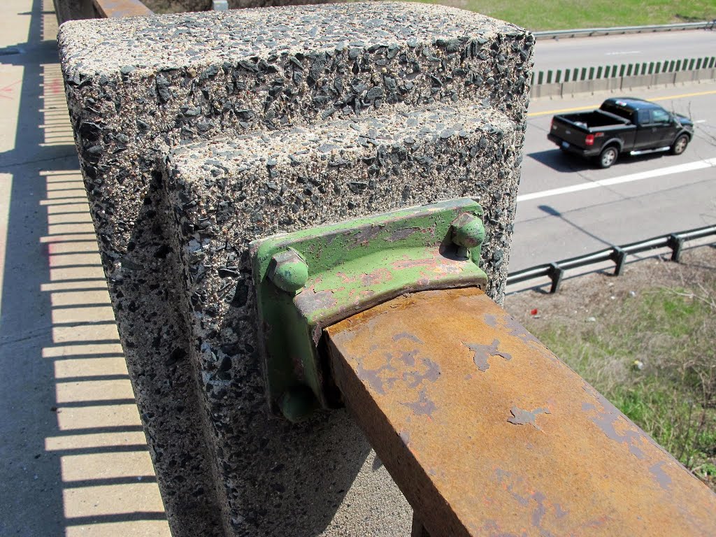 Close-up of one of the rail connections to the concrete piers on the south railing of bridge 5598.