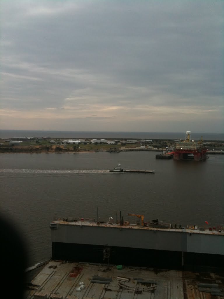 On top of ship looking at island
