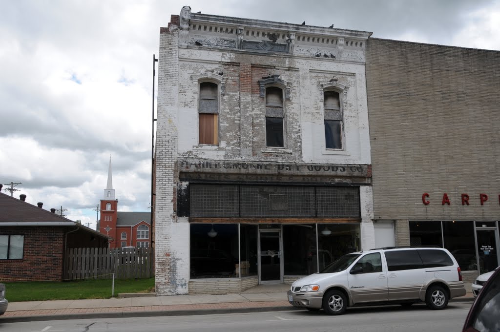 Old building in Nevada, MO still carrying the name of the store Harry Moore Dry Goods Co that closed in 1885