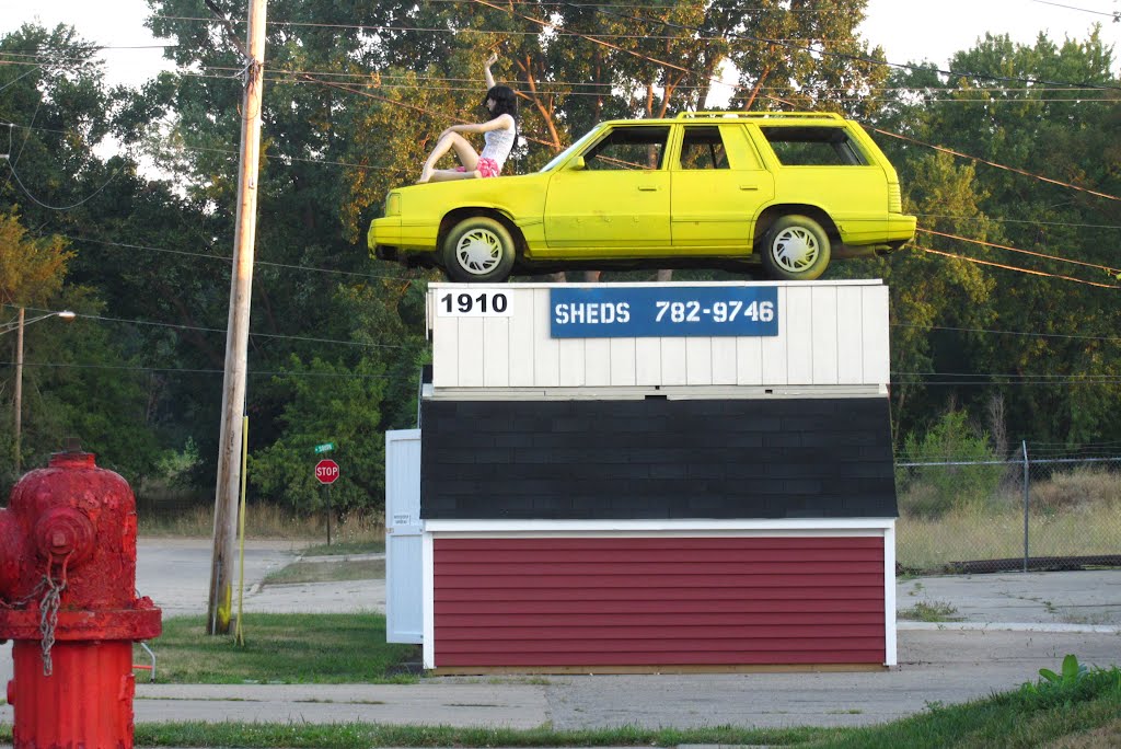 A tough shed can store a car and a wife on the top
