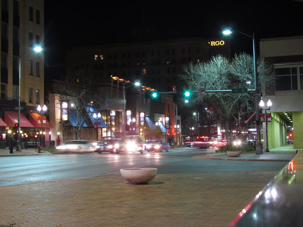 Nighttime in downtown Lincoln, Nebraska, at the intersection of O St. (U.S. Route 34) and 11th St., viewing east-north-easterly.
