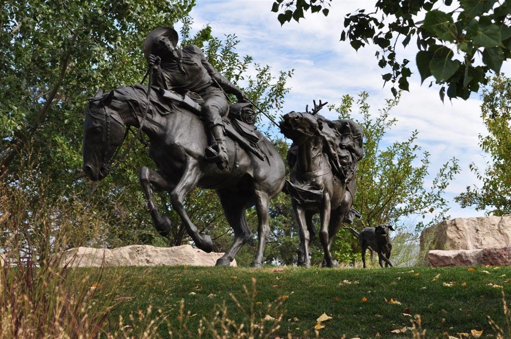 hunter pulling pack horse, Pioneer Courage, Omaha, NE