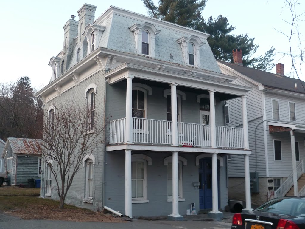 Brick house with double-verandah, mansard roof