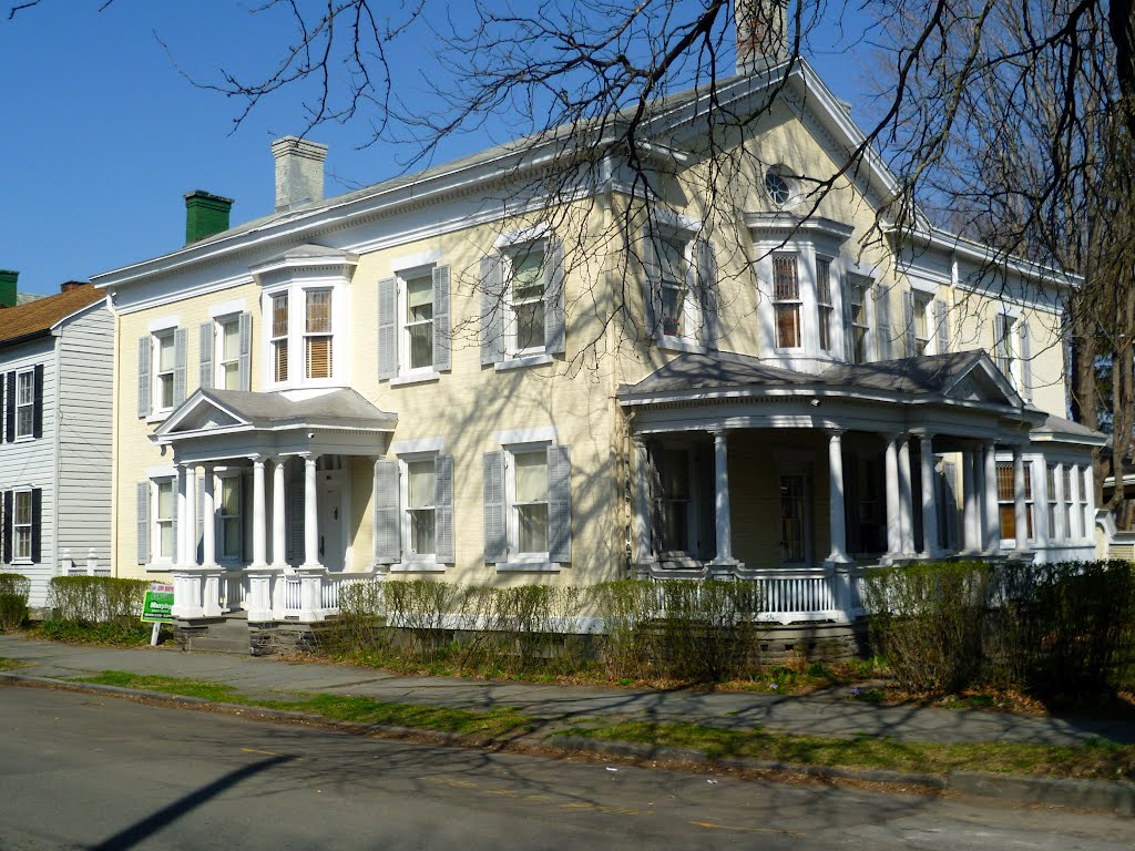 19c. brick house with bow windows & verandahs