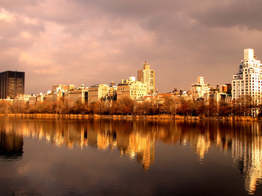 Reflection of buildings in water, Jacqueline Kennedy Reservoir, Central Park, New York