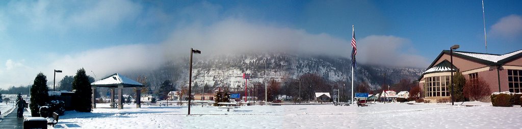 Snowclouds coming over hill