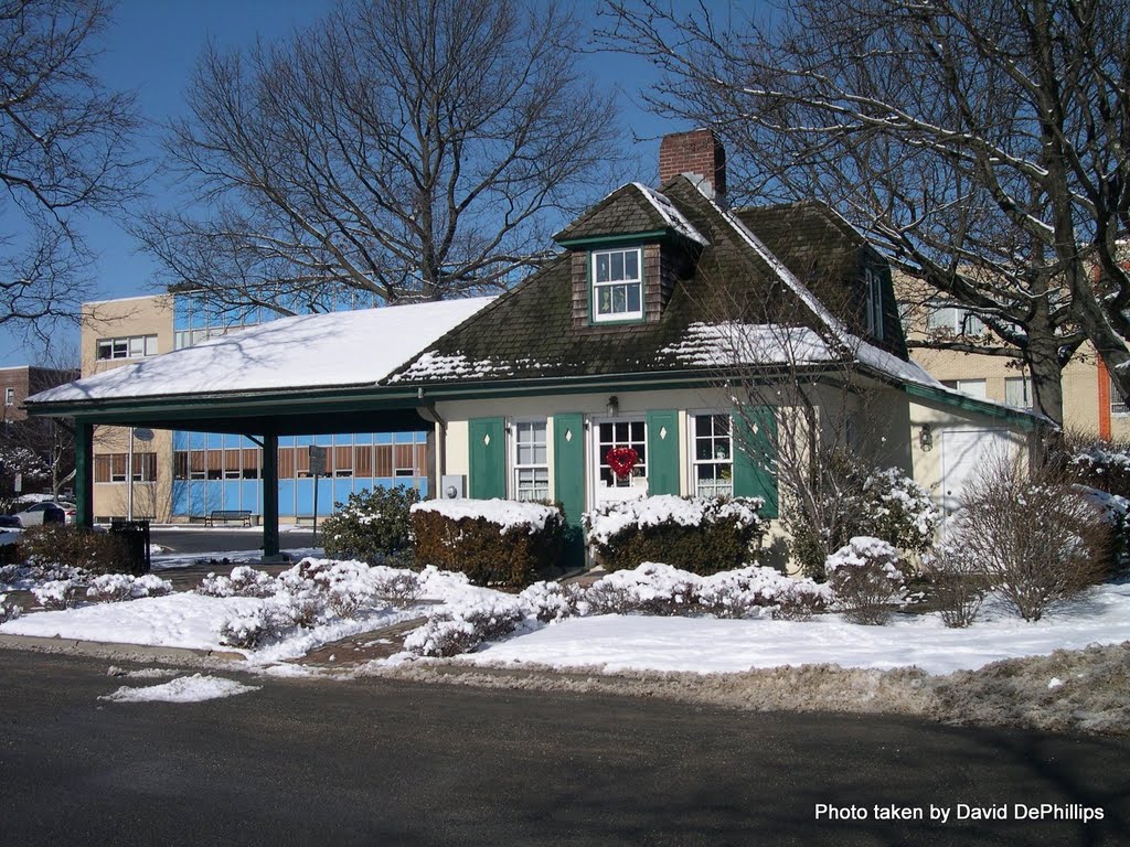 this is the original toll booth for the Vanderbilt Pkwy. now the Southern Pwy on Long Island, the building now serves as the Garden City N.Y Chamber and Visitor Ctr. building in background HQ for AAA