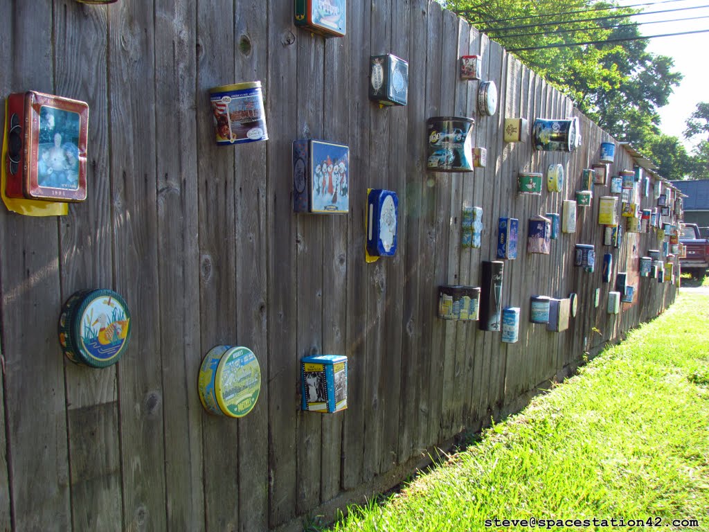 Tin Boxes on a Fence
