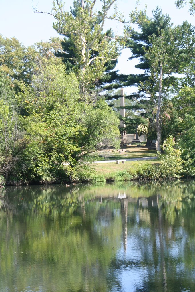 Hale monument reflected in pond, Lakeview Cemetery
