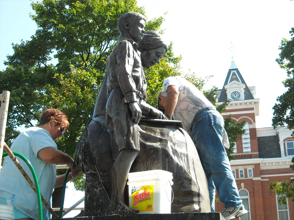 Tom and Mrs. Edison getting a bath in the park