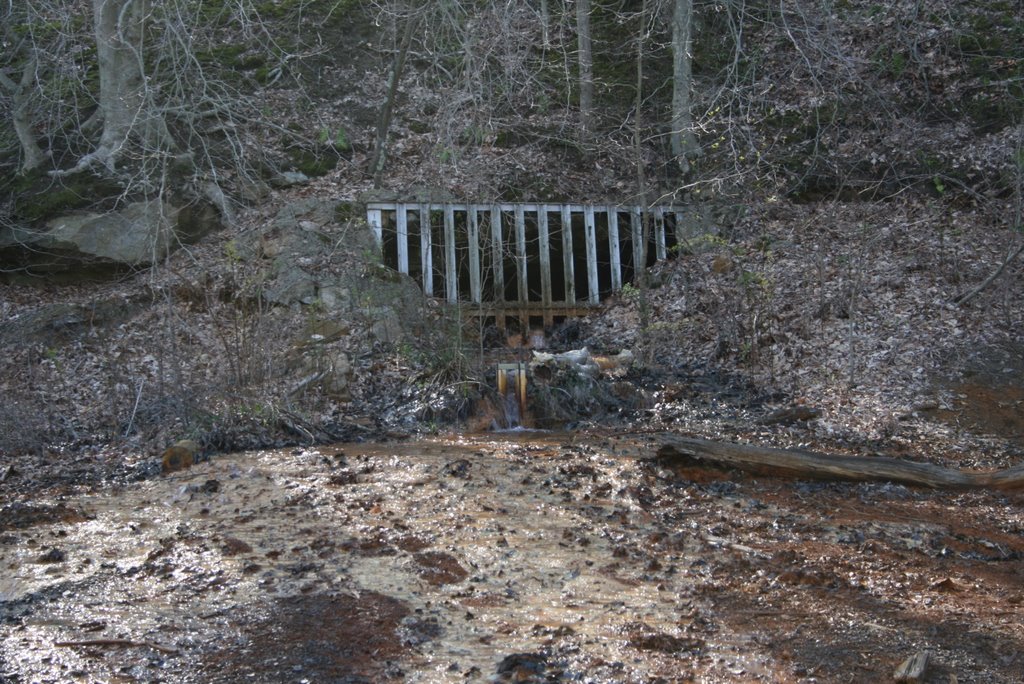 Ex coal mine - Acidic water flowing out of the mine and polluting water courses