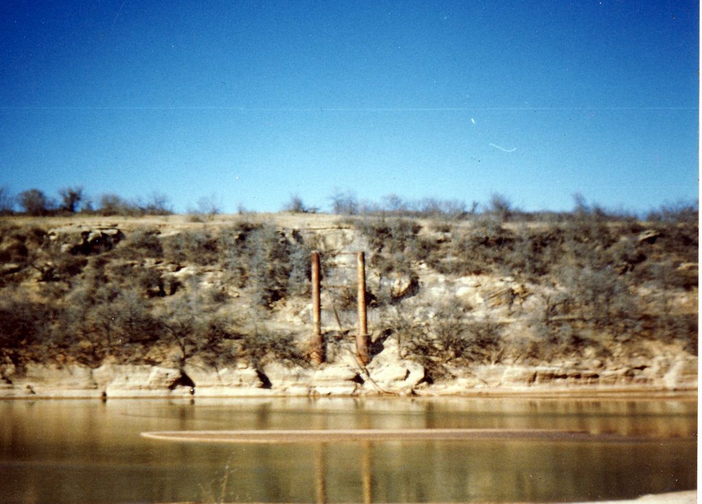 Remains of suspension bridge on the Red River, known as burned out bridge. Photo by R. Rogers.