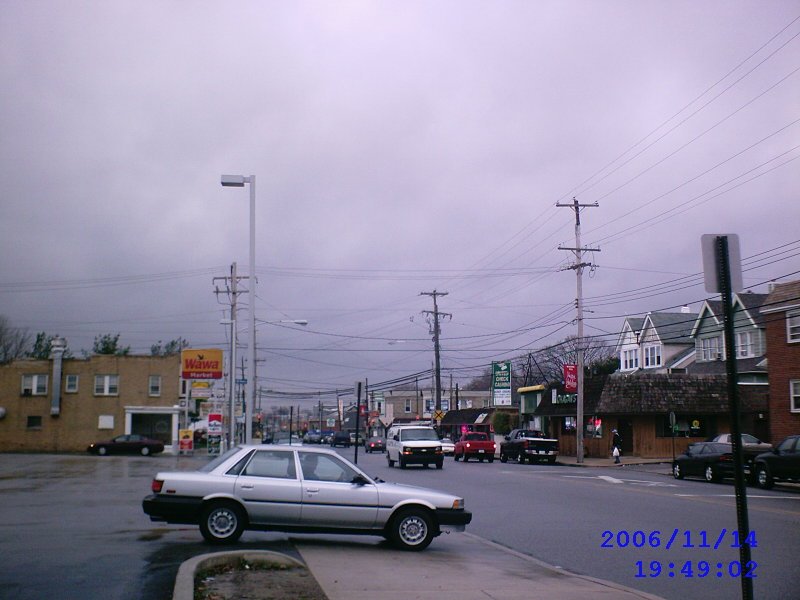 Macdade Blv, outside a Wawa convenience store, facing west