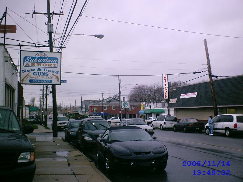 Macdade Blv, facing West. Outside The Suburban Armory gun store and Family Thrift Shoppe