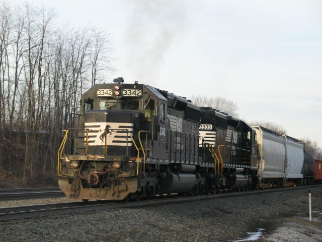 Train running through Cresson and past Cresson train repair shop