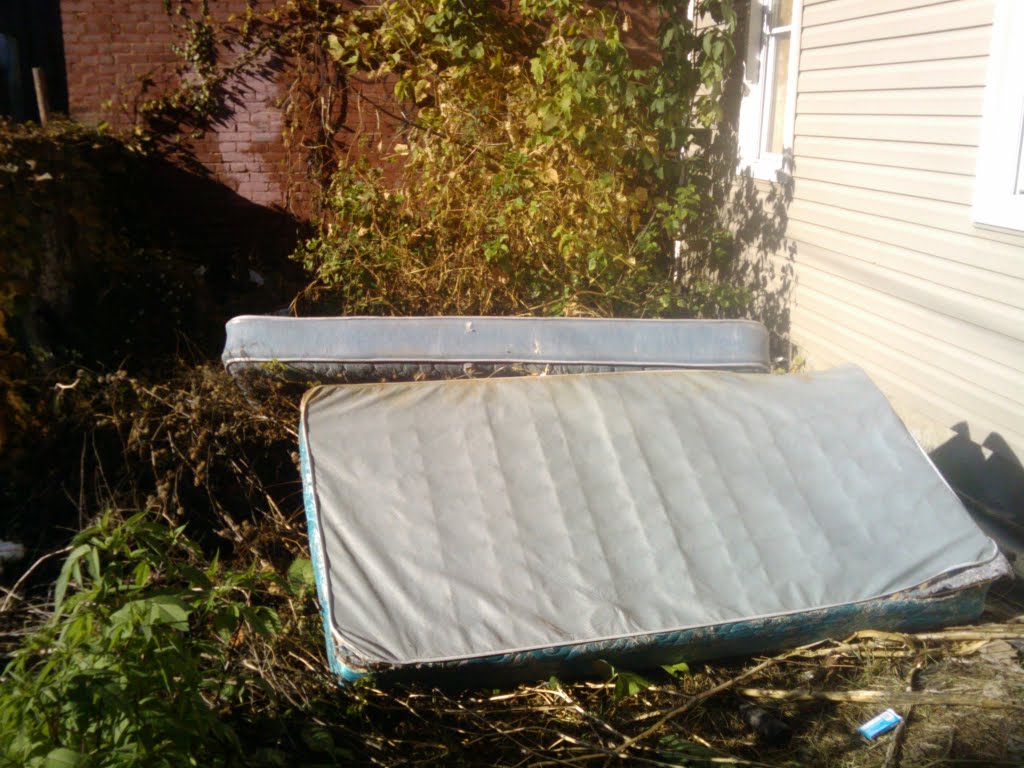 Condemned, getting junk piled outside.