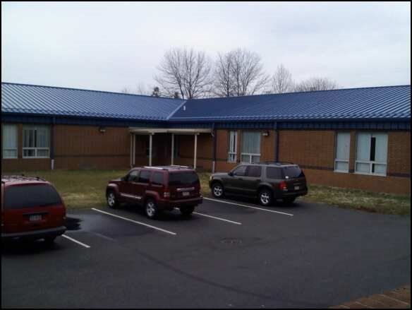 Weird parking lot between the band room and the back wing of the 9th grade center
