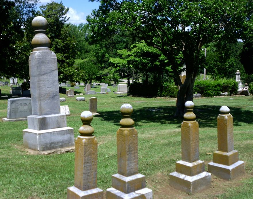 Tombstones evoking the woodturning crafts.