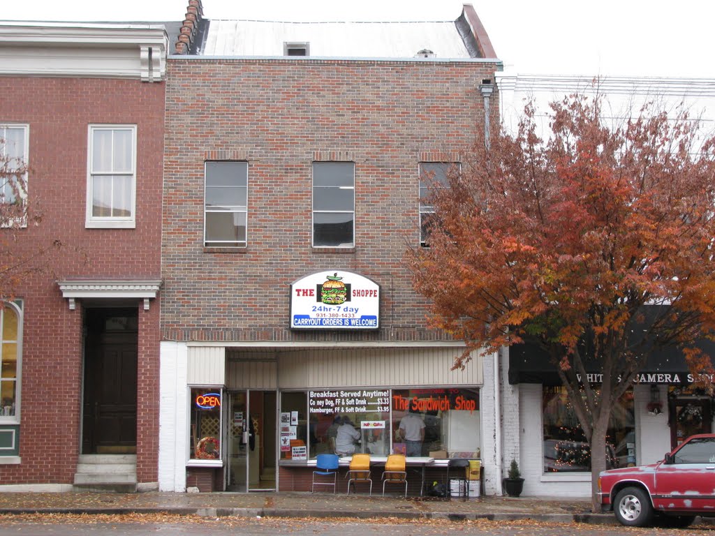 Oldest (?) building at Columbia, Tn courthouse square, built as a house 1817 now the Sandwich Shop where "CARRYOUT ORDERS IS WELCOME" 24 hours