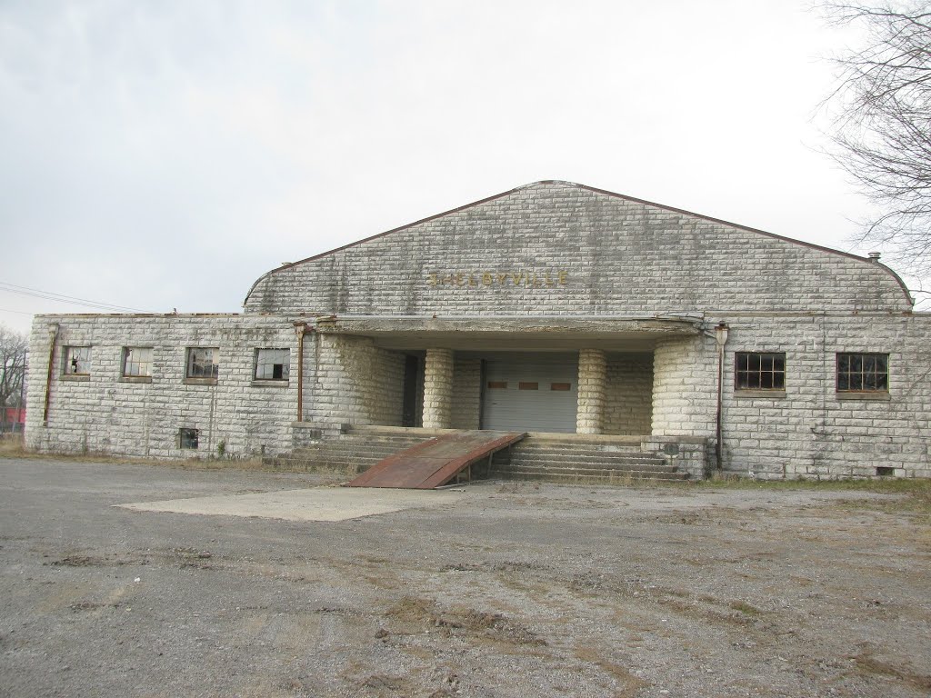 On ramp to Shelbyville, former auditorium now appears to be used  as a Johnny on the spot  service
