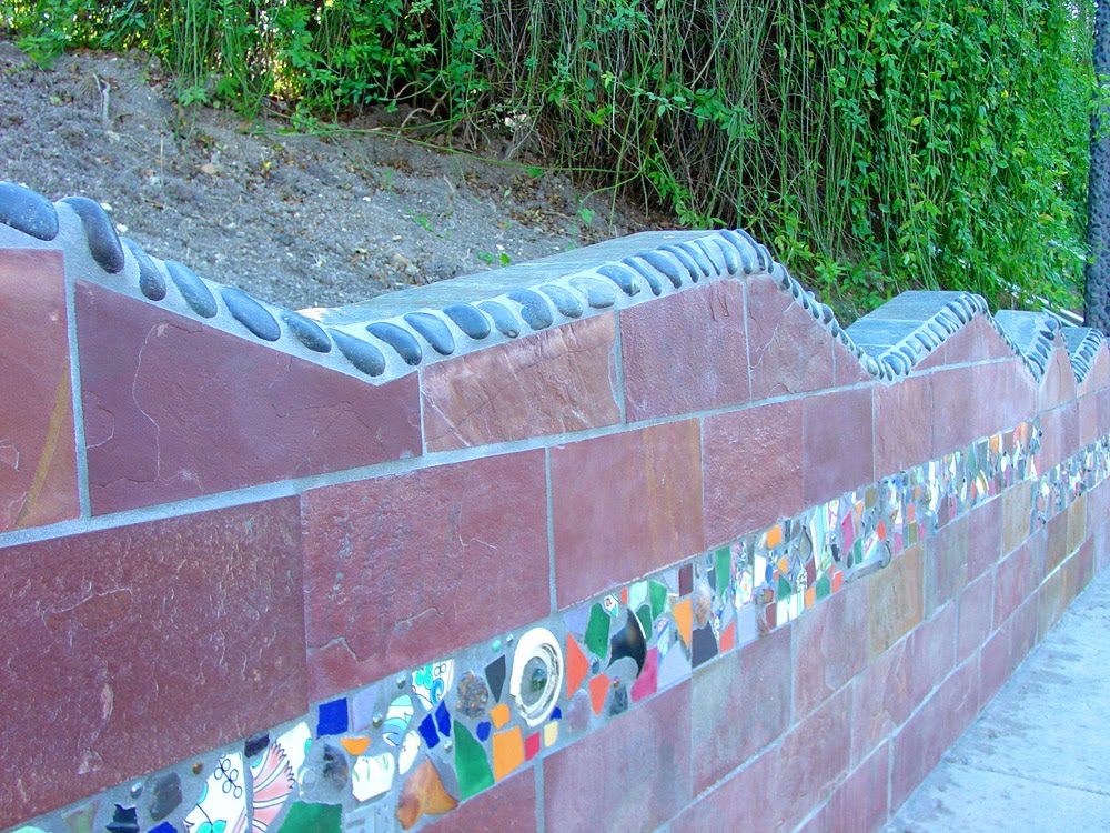 (UNTITLED) FULTON STREET ENHANCEMENTS- Twyla Arthur, 2003. Tile and stone mosaic on retaining wall feature memorabilia collected from area residents; floral mural on underpass support walls