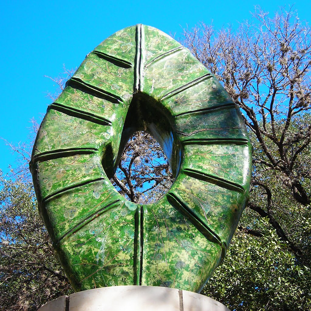 Quercus- Susan Budge, 2006  Ceramic dark green sculpture that is  diamond shaped with a hollow acorn center