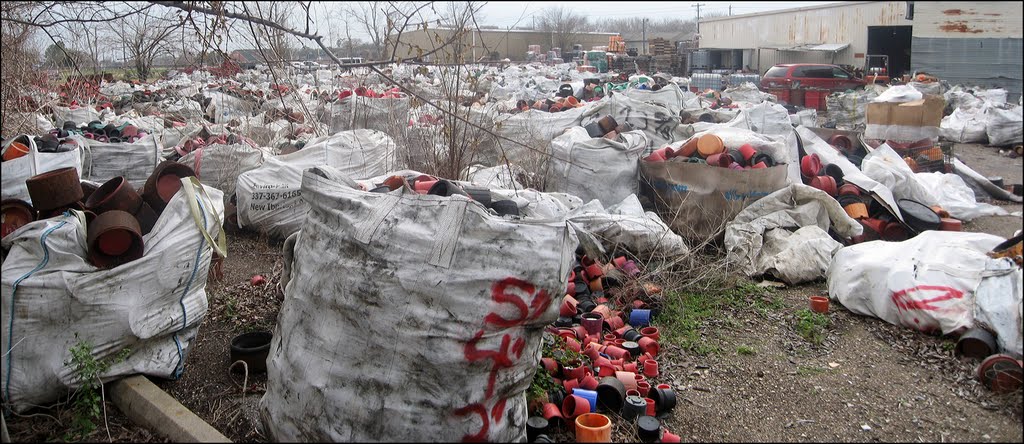 A huge junkyard of oilfield pipe thread protectors