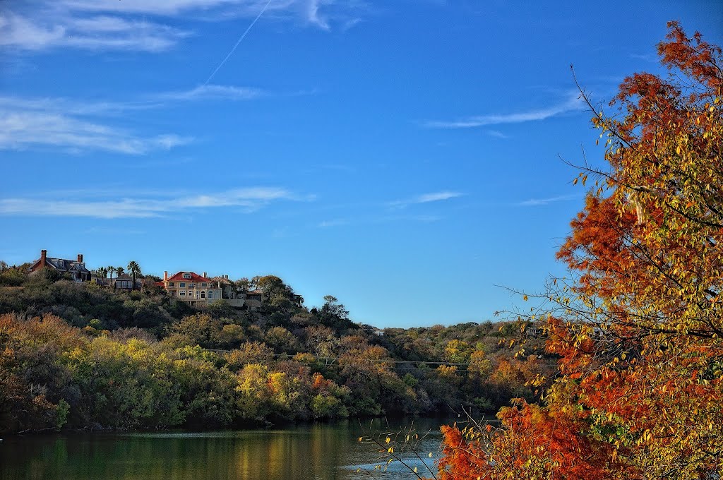 Homes on a Hillside. I wanted to capture the colors of the two side of the hillsides between Lady Bird Lake. Reds on the right and green & yellows on the left with blue skies above. It was this contrast of colors that struck me here.