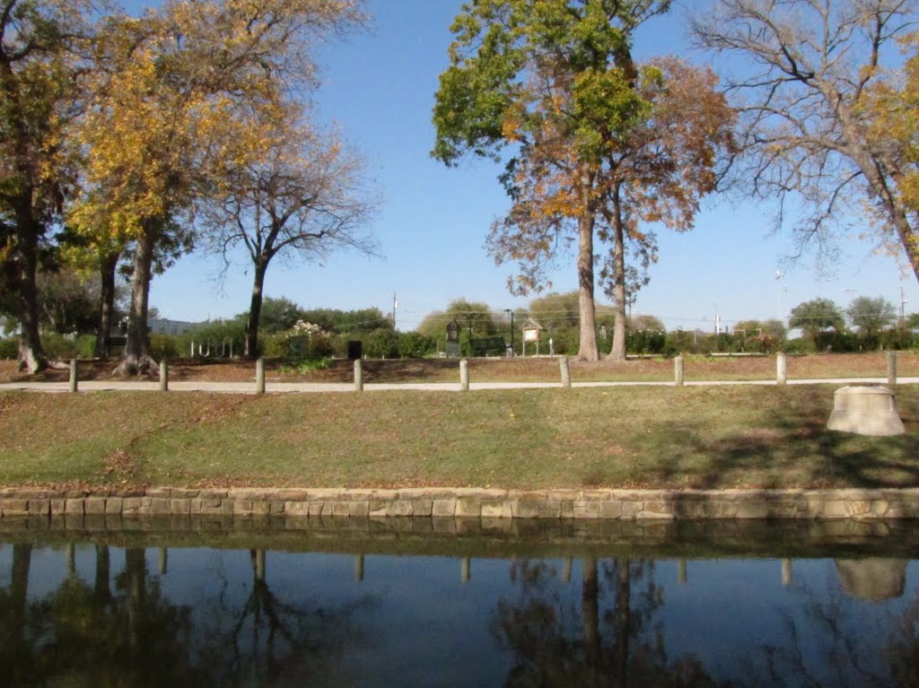 Rawhide Dr in Wattenworth Park with Rose Gardens in background - seen from accross the water