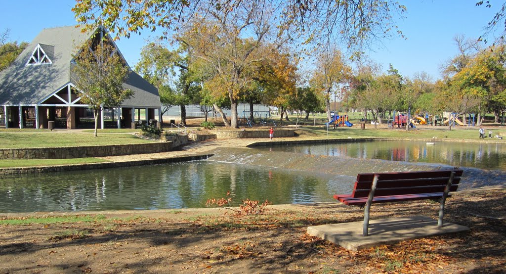 Pavilion, dam, and kids playground in Watterworth Park (view across Rawhide Creek)