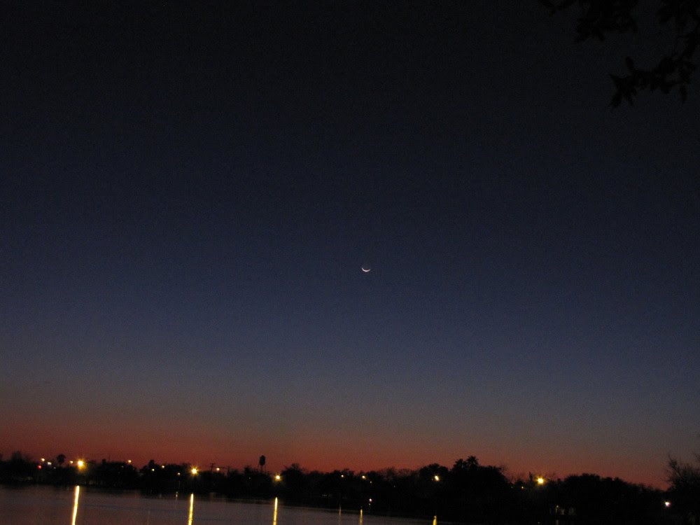 Waxing crescent moon setting over Harlingen, Texas  February 15, 2010