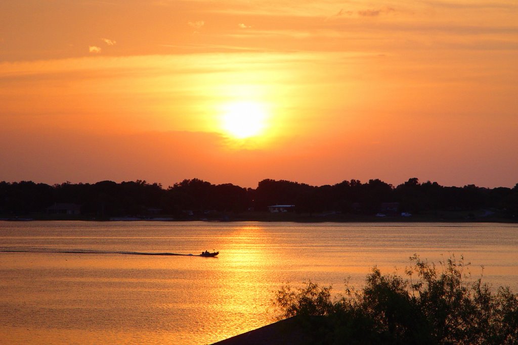 fishing boat at sunset on Eagle Lake Fla (5-2008)