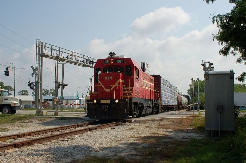 Florida Midland Railroad Local Freight Train, with Florida Central Railroad EMD/ATSF CF7 No. 56 providing power, crosses Lake Shipp Drive at Eloise, FL