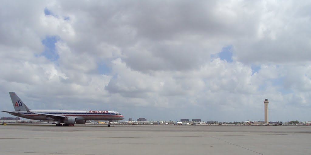 Panoramic of Miami International Airport Tower & AA Boeing 757 ready for take off