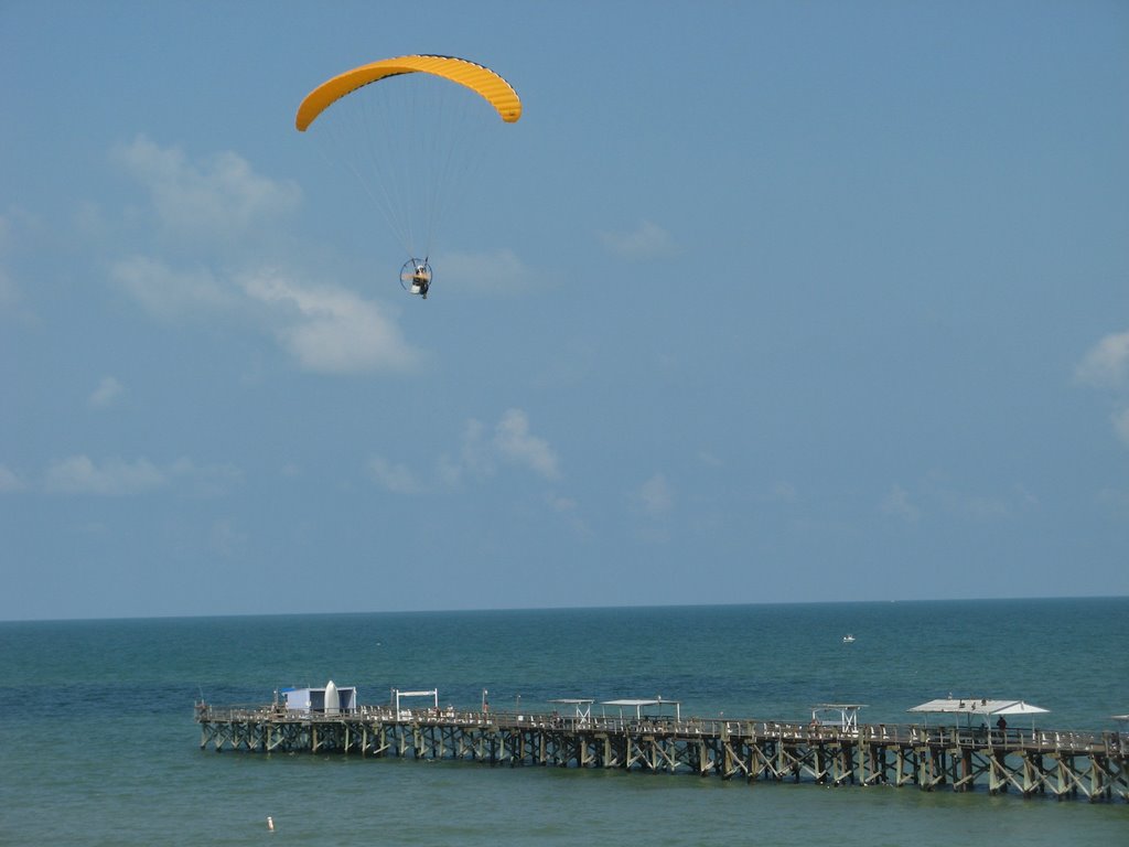 Parachuter over pier