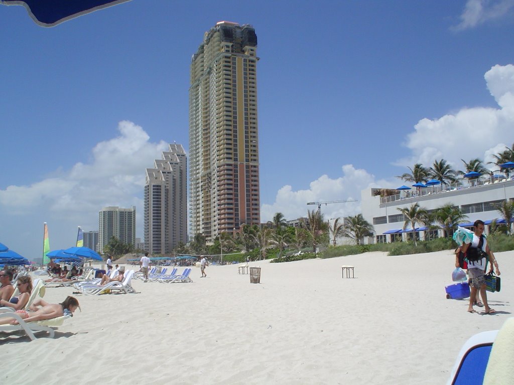 Sunny Isles Beach. Almost one million vacationers visit Sunny Isles Beach each year to enjoy a two-mile long fine sand beach and outdoor activities such as water sports, boating, fishing and tennis