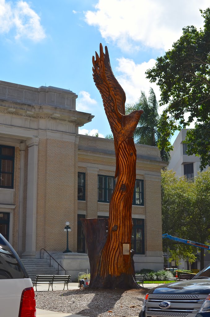 Eagle carving on tree trunk