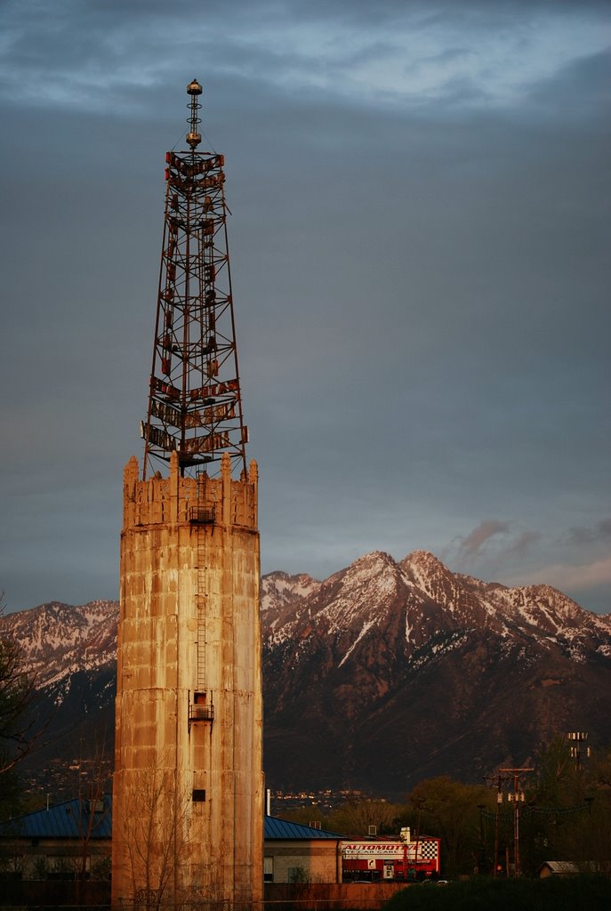 Rain soft water tower at sunset with the Wasatch mountains in the background.