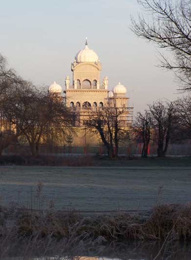The Guru Nanak Gurdwara Building is in Queens Park viewed from Kempston riverside