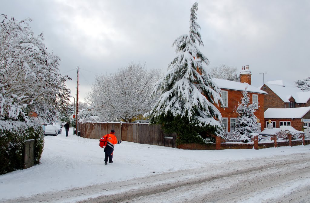 Delivering post in the snow. Horsell High St