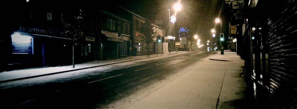 Glossop High Street at night with snow