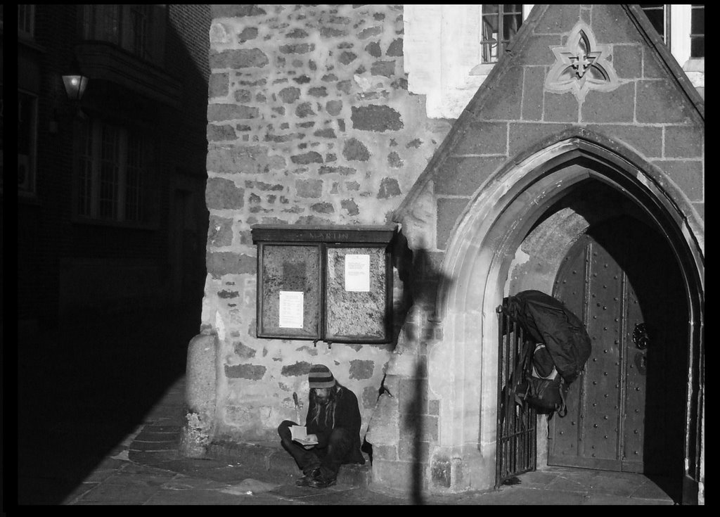 he hung his bags on the church gate and started to read aloud