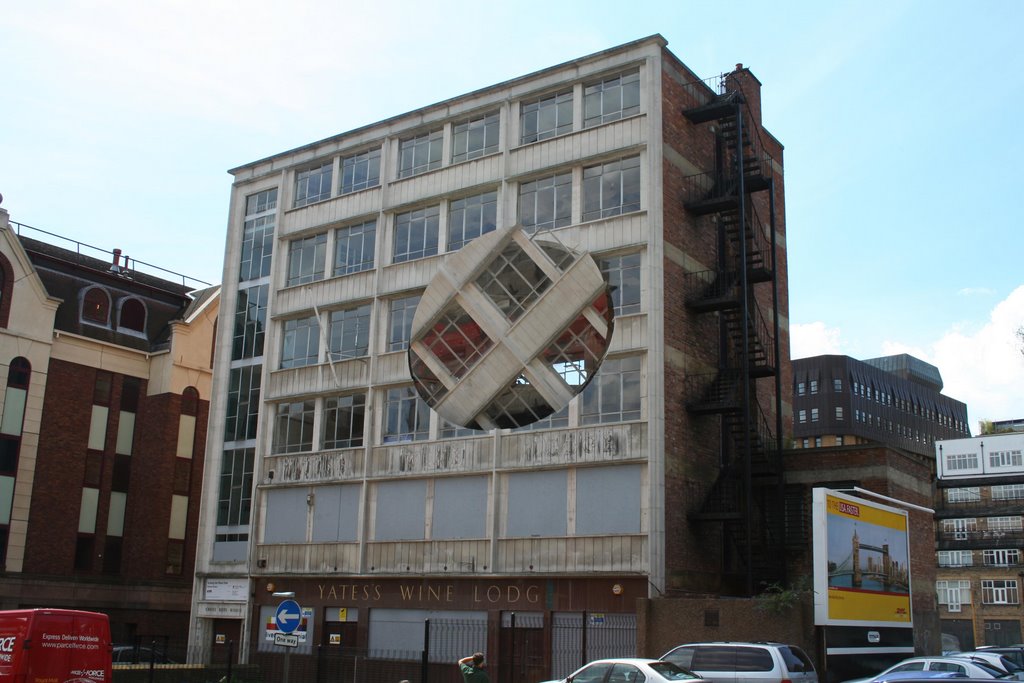 A circular section has been cut out of the front of the building - and it rotates slowly. Yes. But is it art?