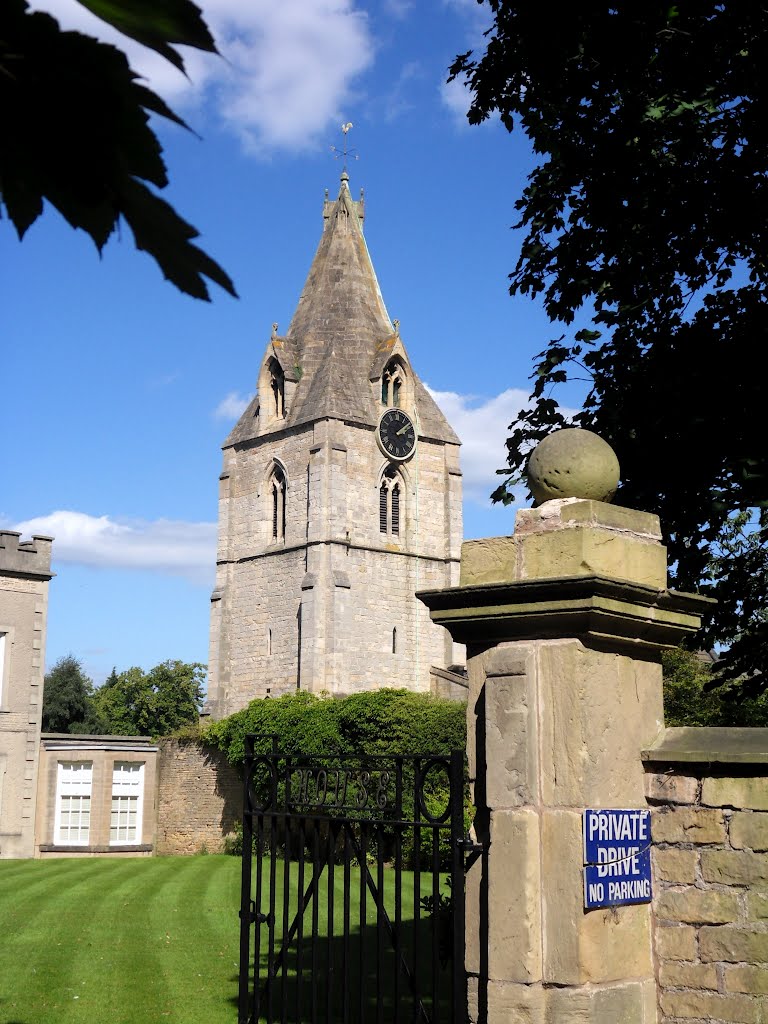 The tower and spire of St Edmund King and Martyr church at Mansfield Woodhouse .